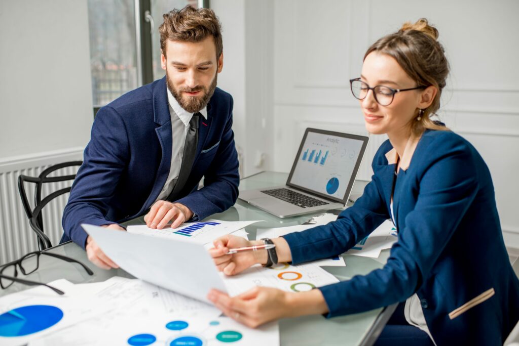 two businesspeople reviewing